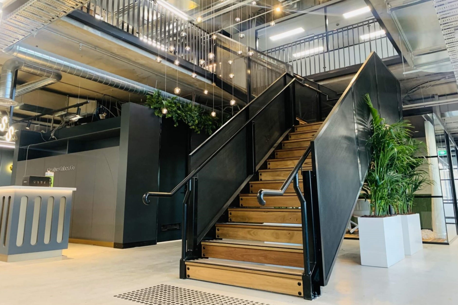 An image of a staircase built by taitform with premium black powdercoat finish.